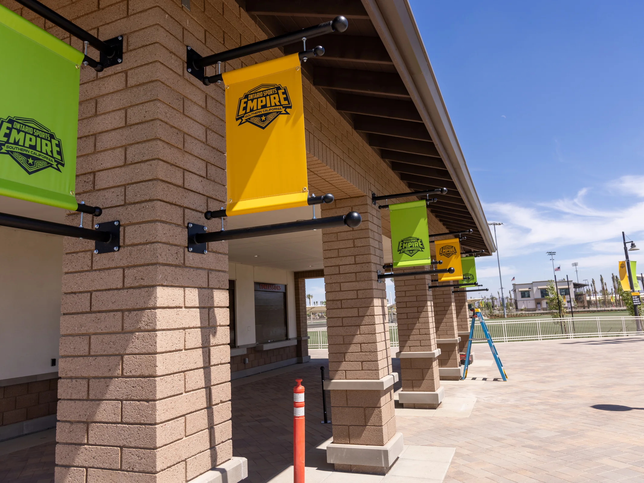 Ontario Sports Empire venue building with yellow and green banners