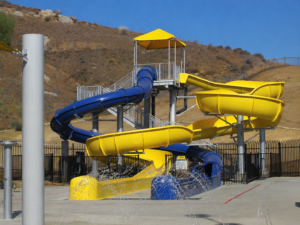 Yellow and blue water slides at Martin Tudor Splash Park in Fontana