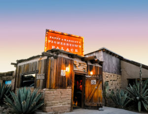 Pappy and Harriet’s Pioneertown Palace exterior and sign at dusk