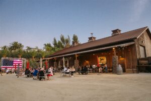The Crush House exterior and outdoor tables at Peltzer Winery in Temecula