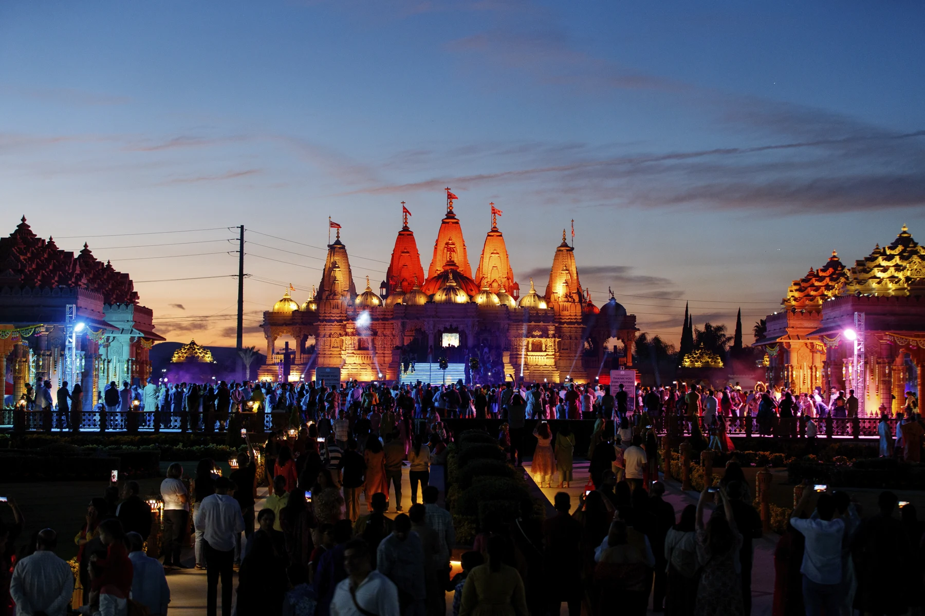 Illuminated mandir during a past gathering; event date not supplied