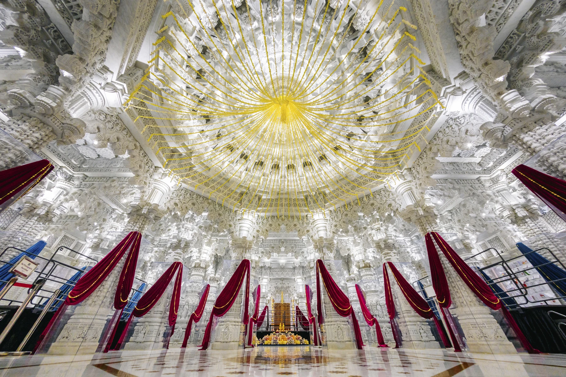 Carved interior and chandelier at BAPS Los Angeles