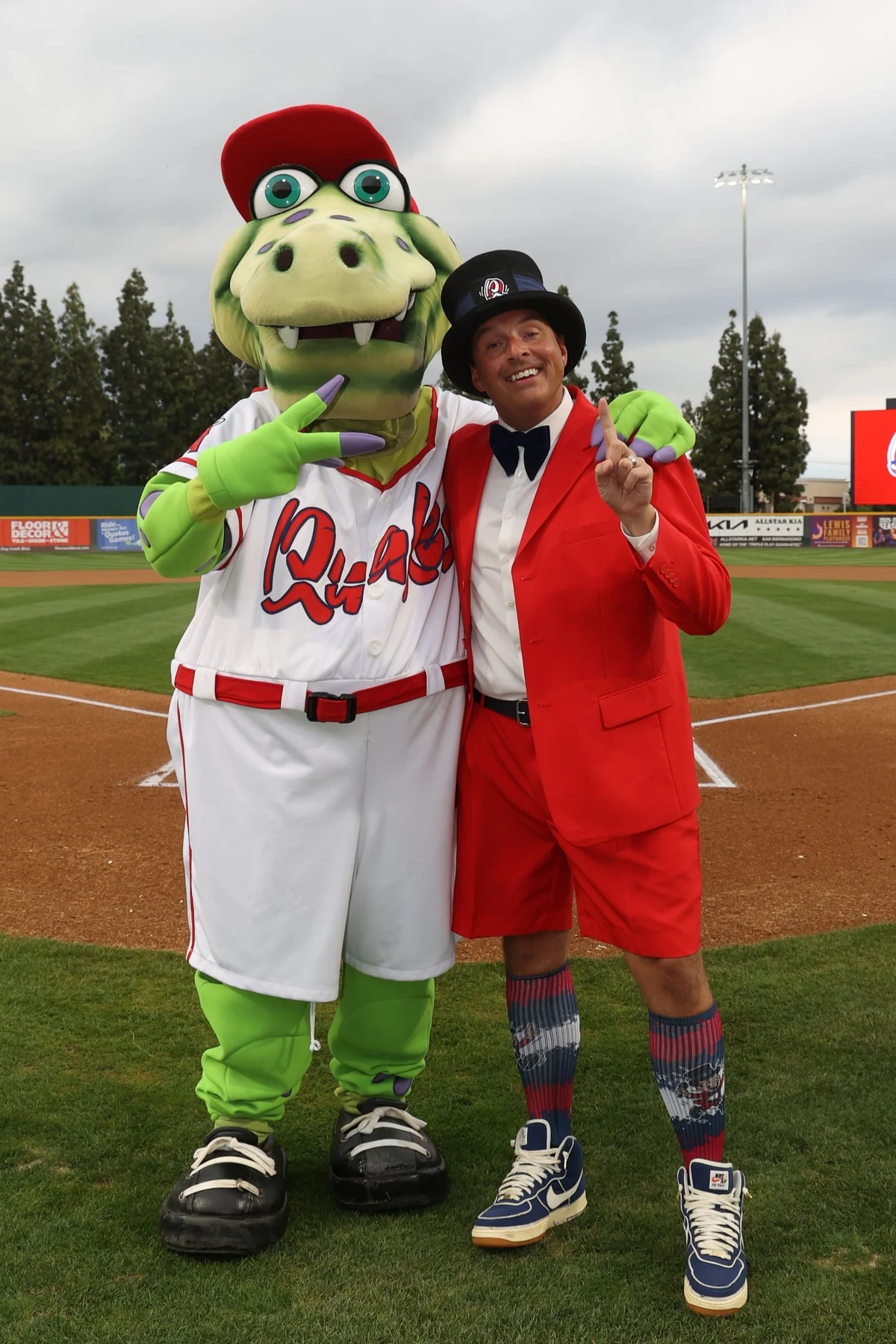 Quakes mascot and guest on the ballfield
