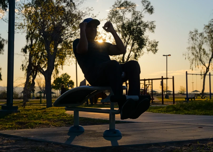 Using the outdoor exercise equipment at Jack Smith Park