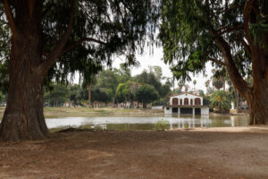Boathouse and lake framed by trees at Fairmount Park