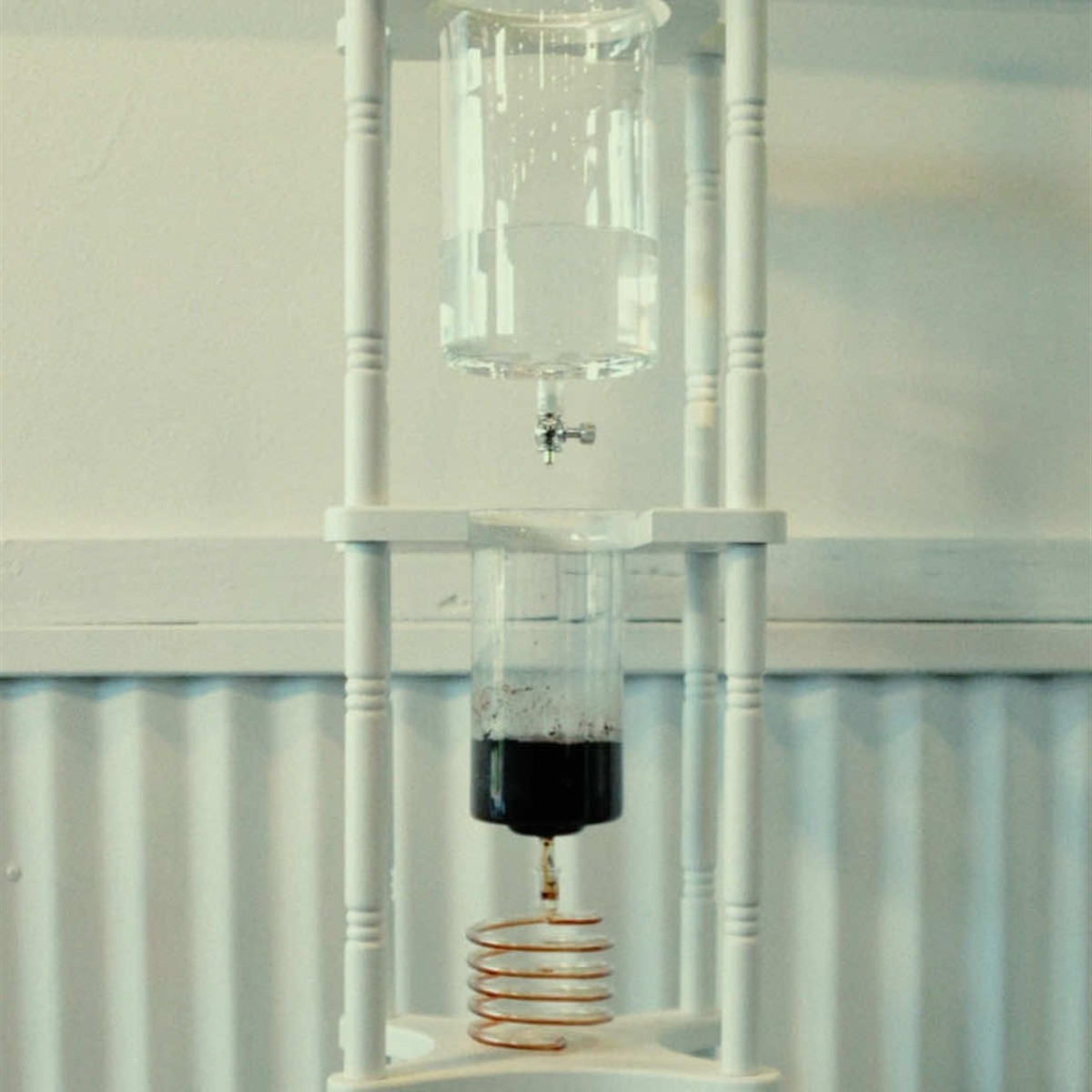 Glass cold-drip coffee tower inside Gaffle Coffee in Temecula