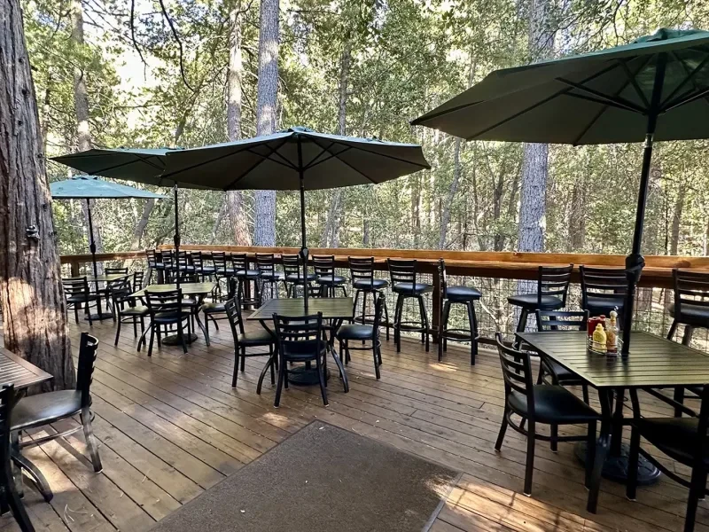 Outdoor dining patio at The Peak near the village