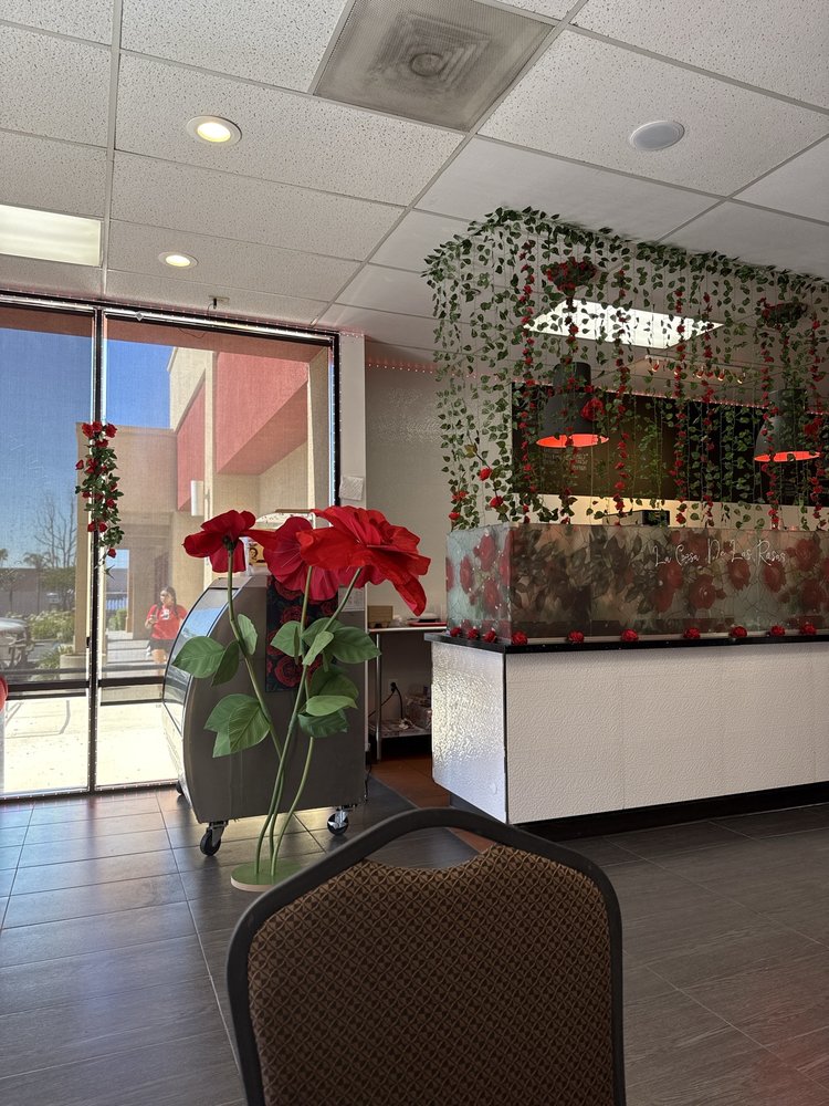 Interior seating area and floral decor at Maas Coffee & More in Chino