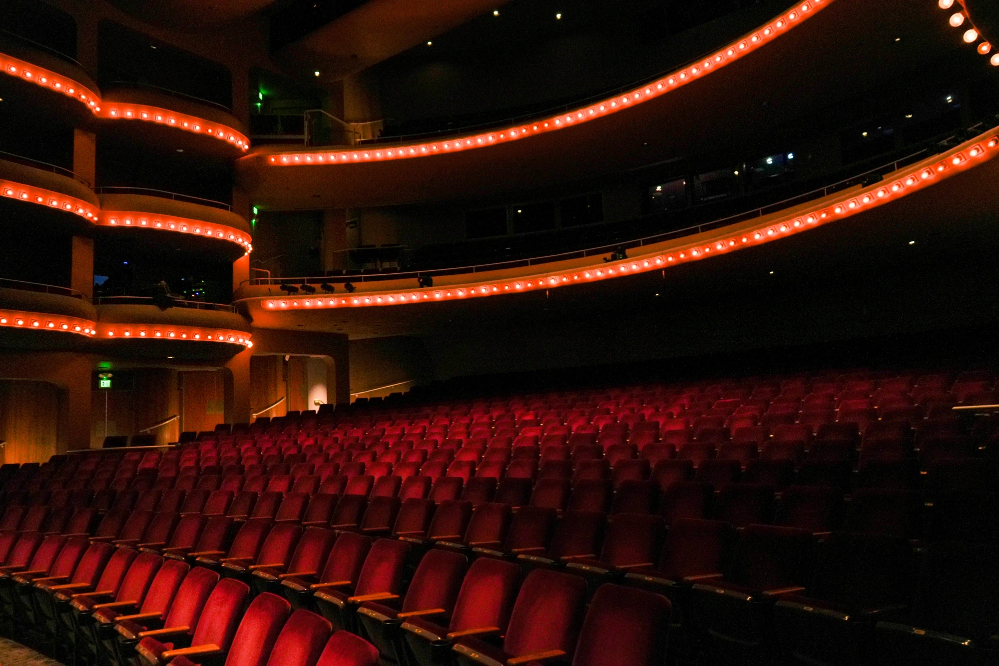 Auditorium seating and illuminated balconies at McCallum Theatre