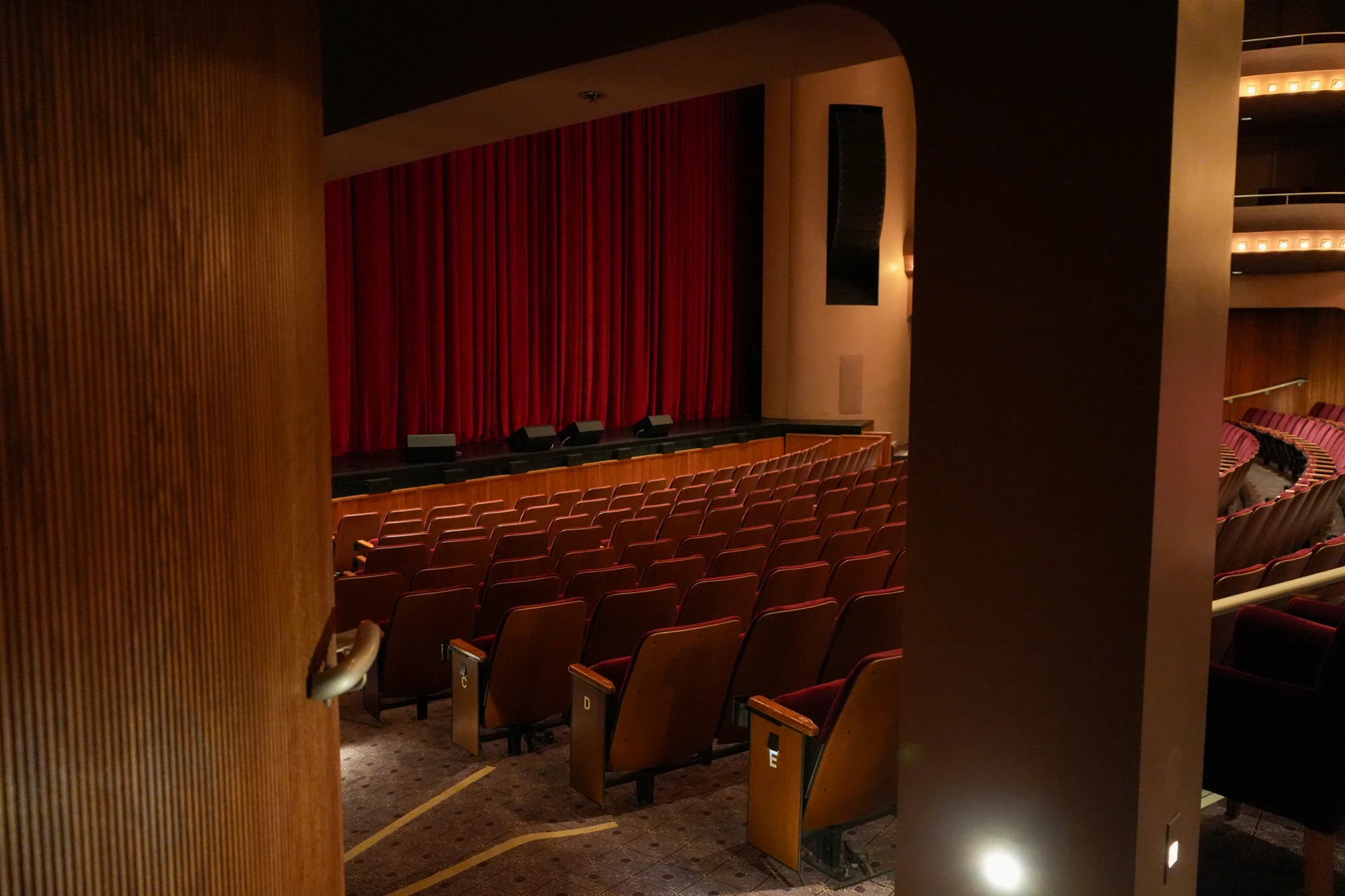 Stage and red curtain viewed from the auditorium at McCallum Theatre