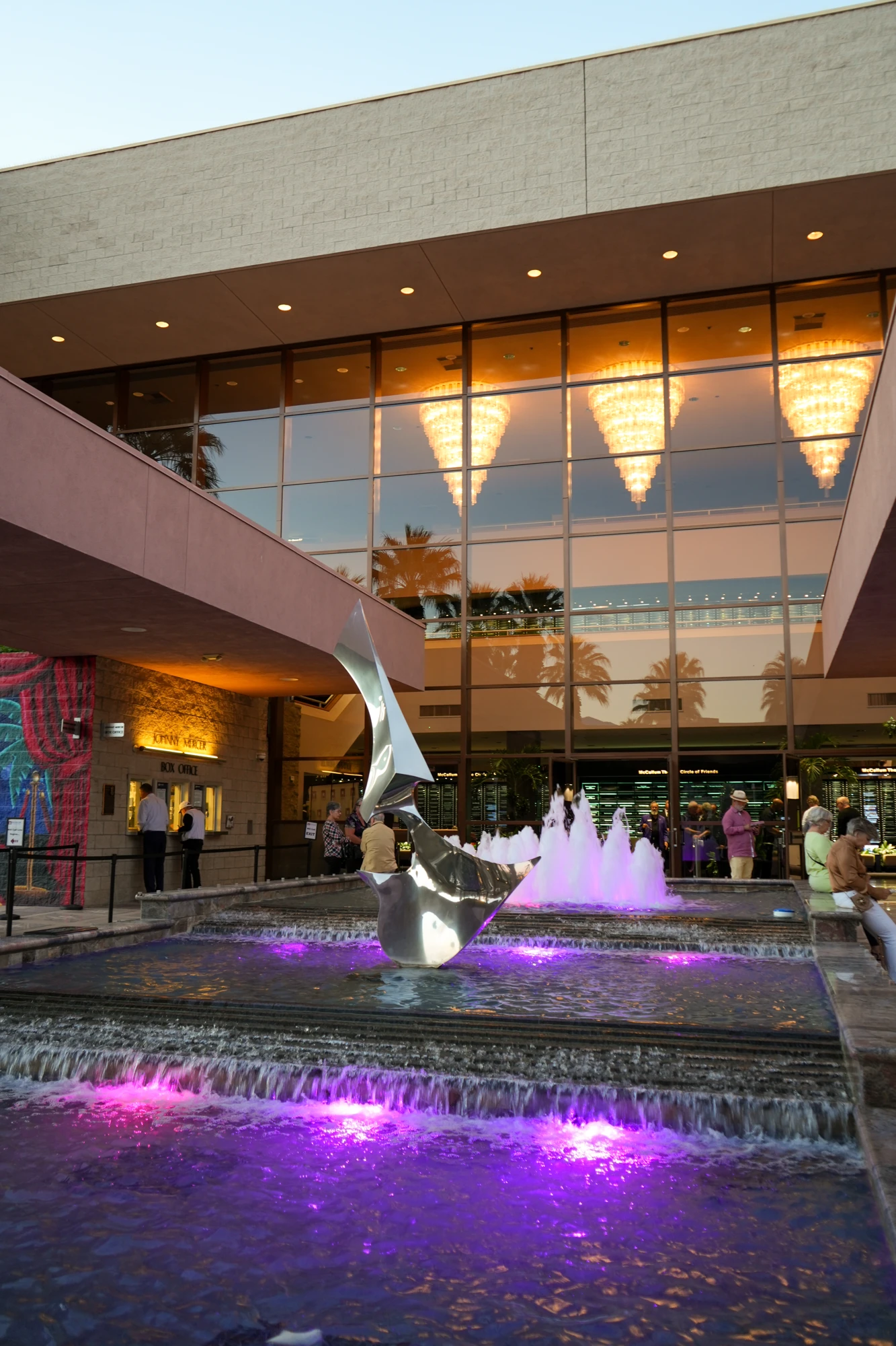 Entrance fountain and illuminated lobby windows at McCallum Theatre
