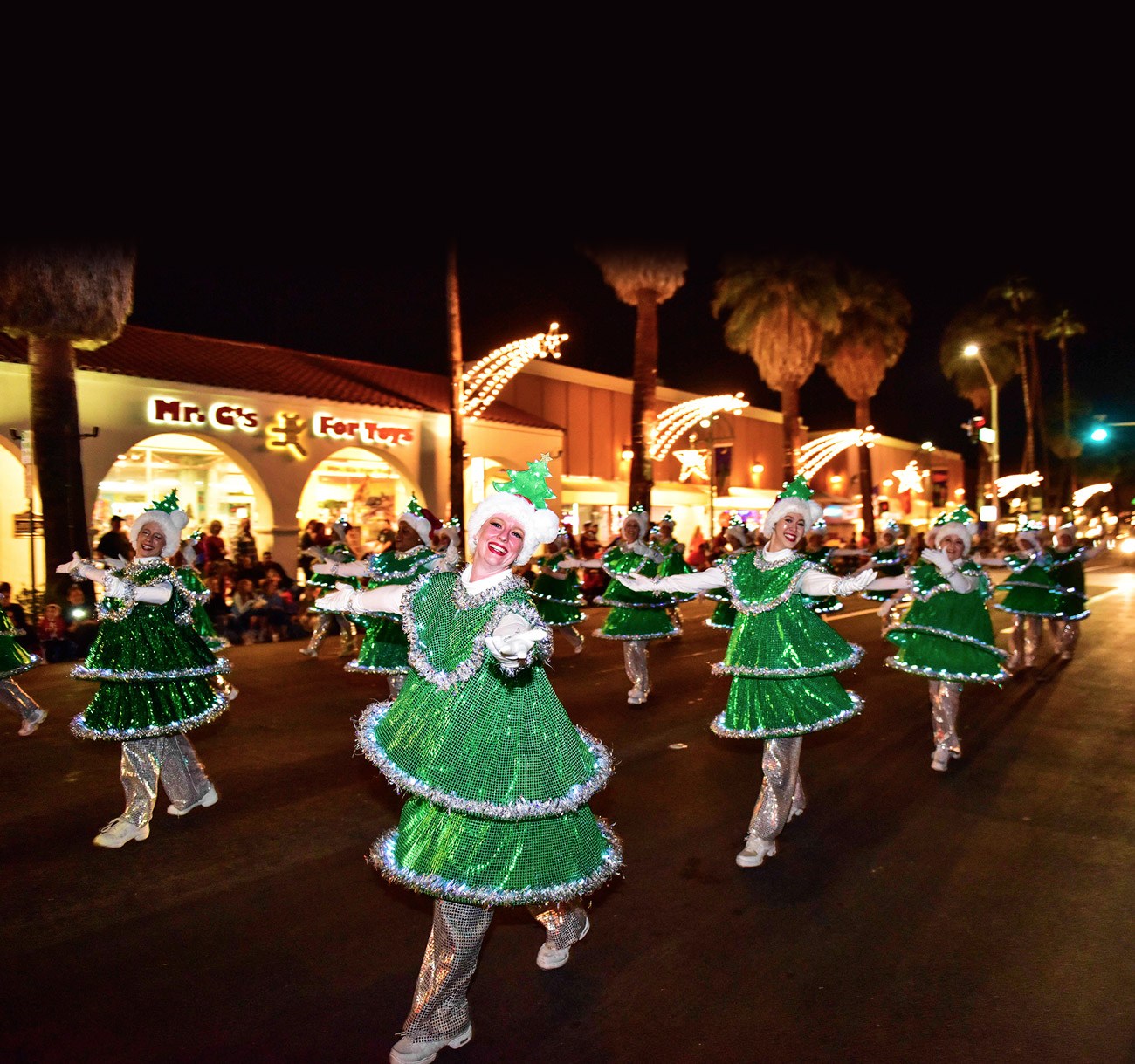 Performers in illuminated Christmas-tree costumes at a previous Palm Springs Festival of Lights Parade
