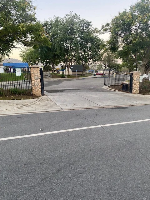Tree-lined park entrance and parking area